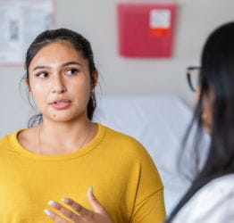 woman talking with doctor
